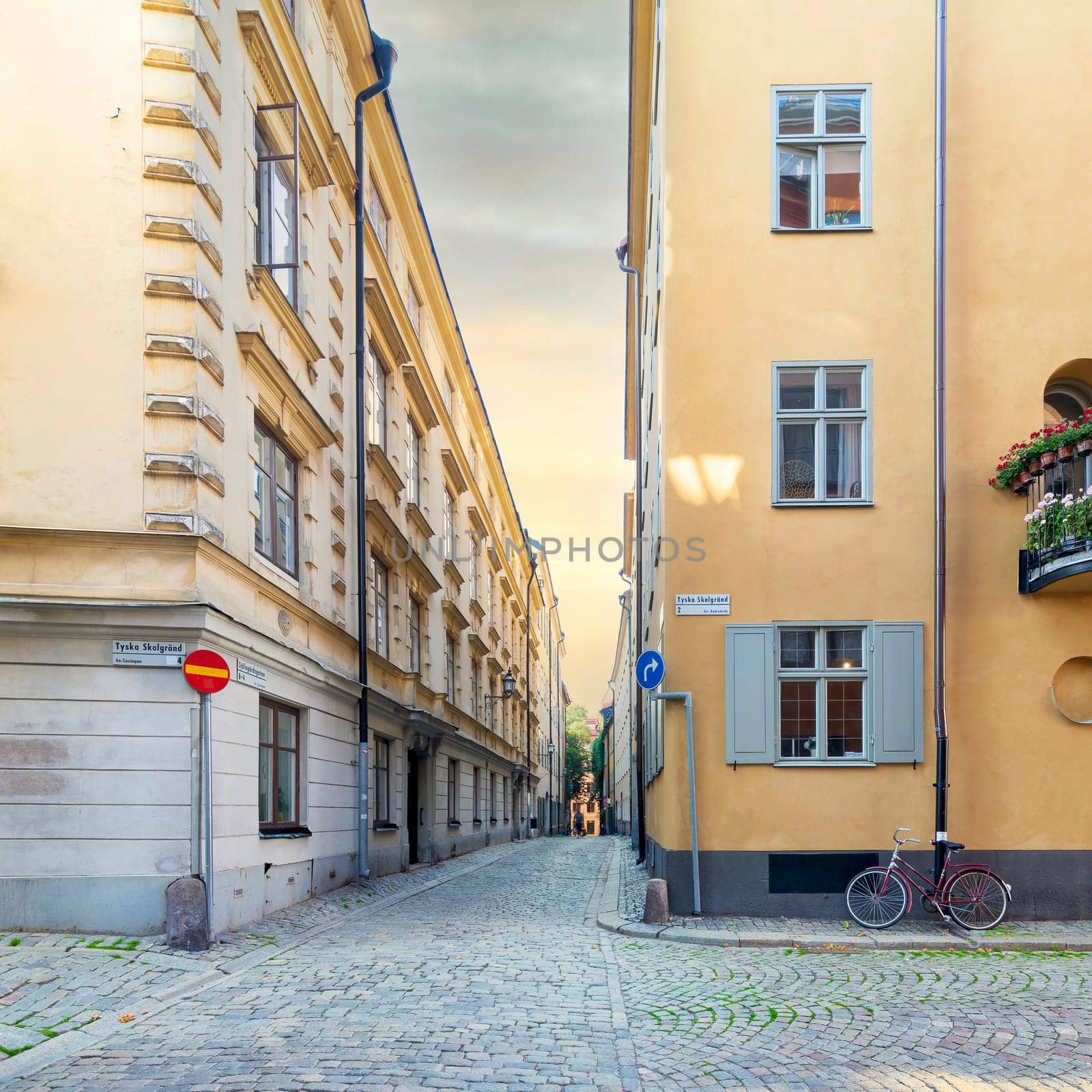 Narrow alleys located in Gamla stan, the old town of Stockholm, Sweden with old style orange houses and cobblestone streets, Stockholm, Sweden