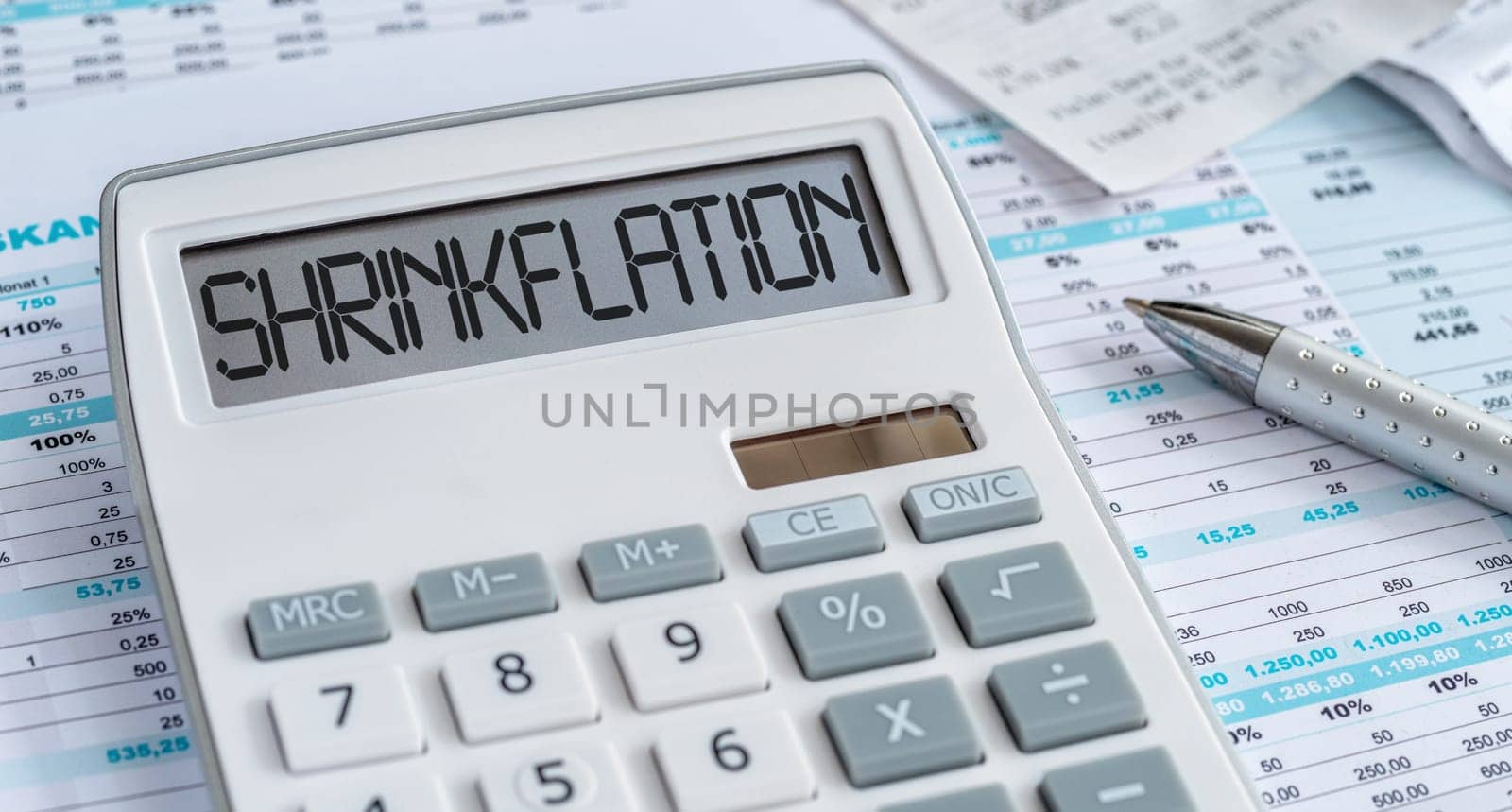 A calculator with the word Shrinkflation on the display