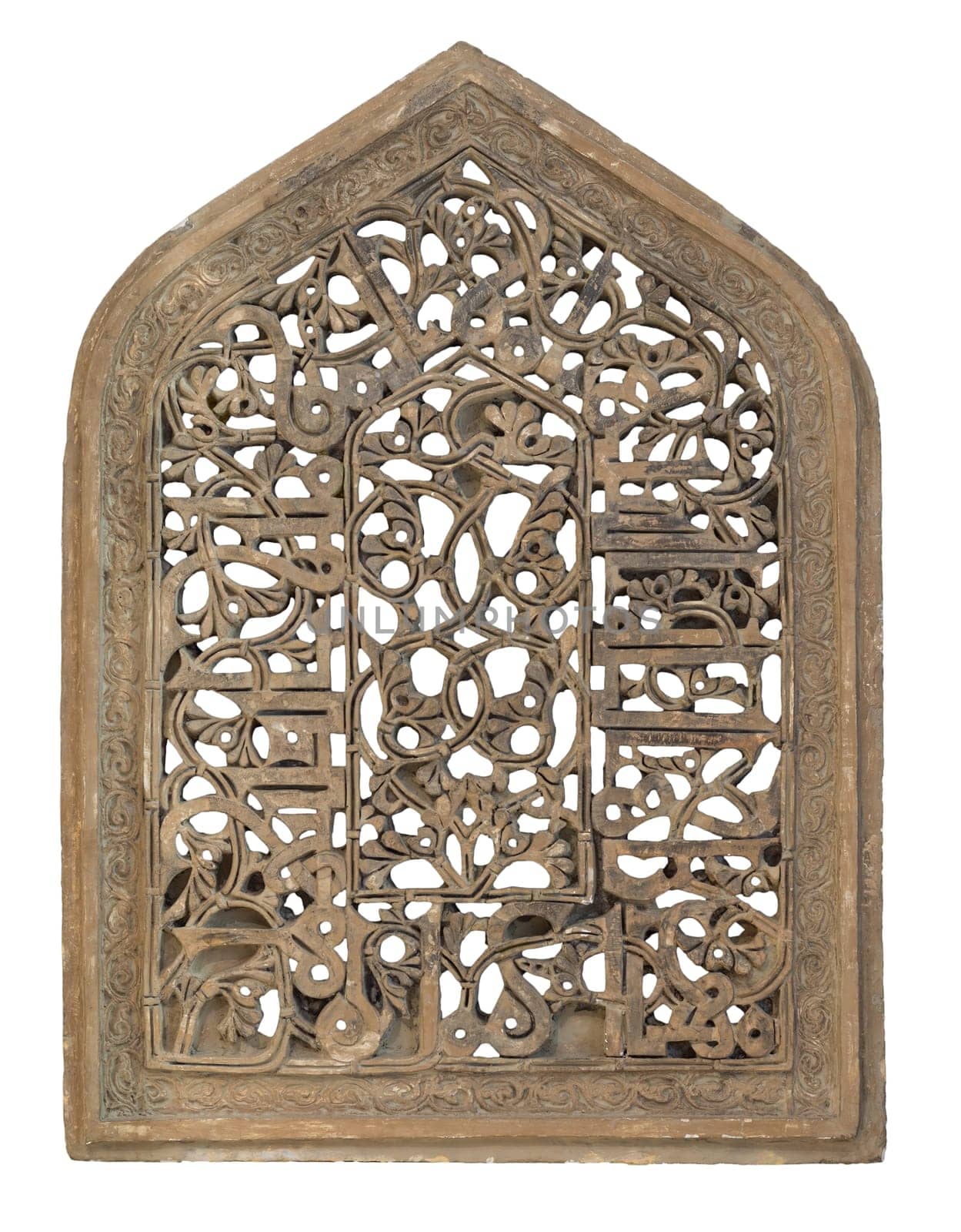 Perforated arched stucco window decorated with floral patterns, one of the traditions of the Fatimid era, isolated on white with clipping path