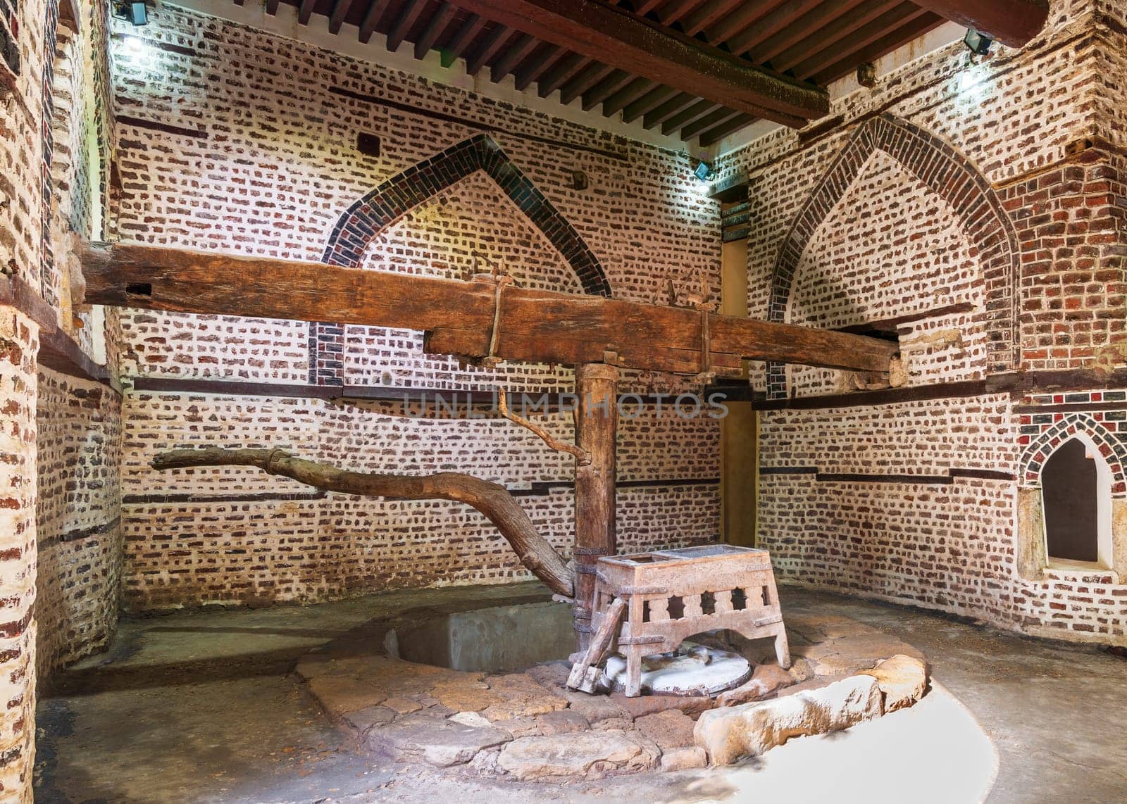 Ancient rotary Flour Mill used to be rotated by animal power, known as Abu Shaheen Mill with black and red bricks wall, located next to El Amasely historic house, Rosetta city, Egypt
