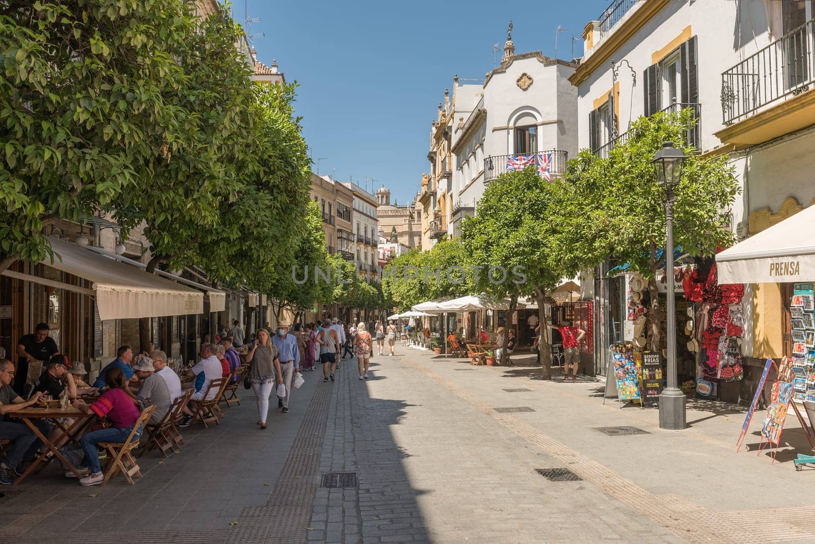 small narrow street in the historic old town of Seville, Spain