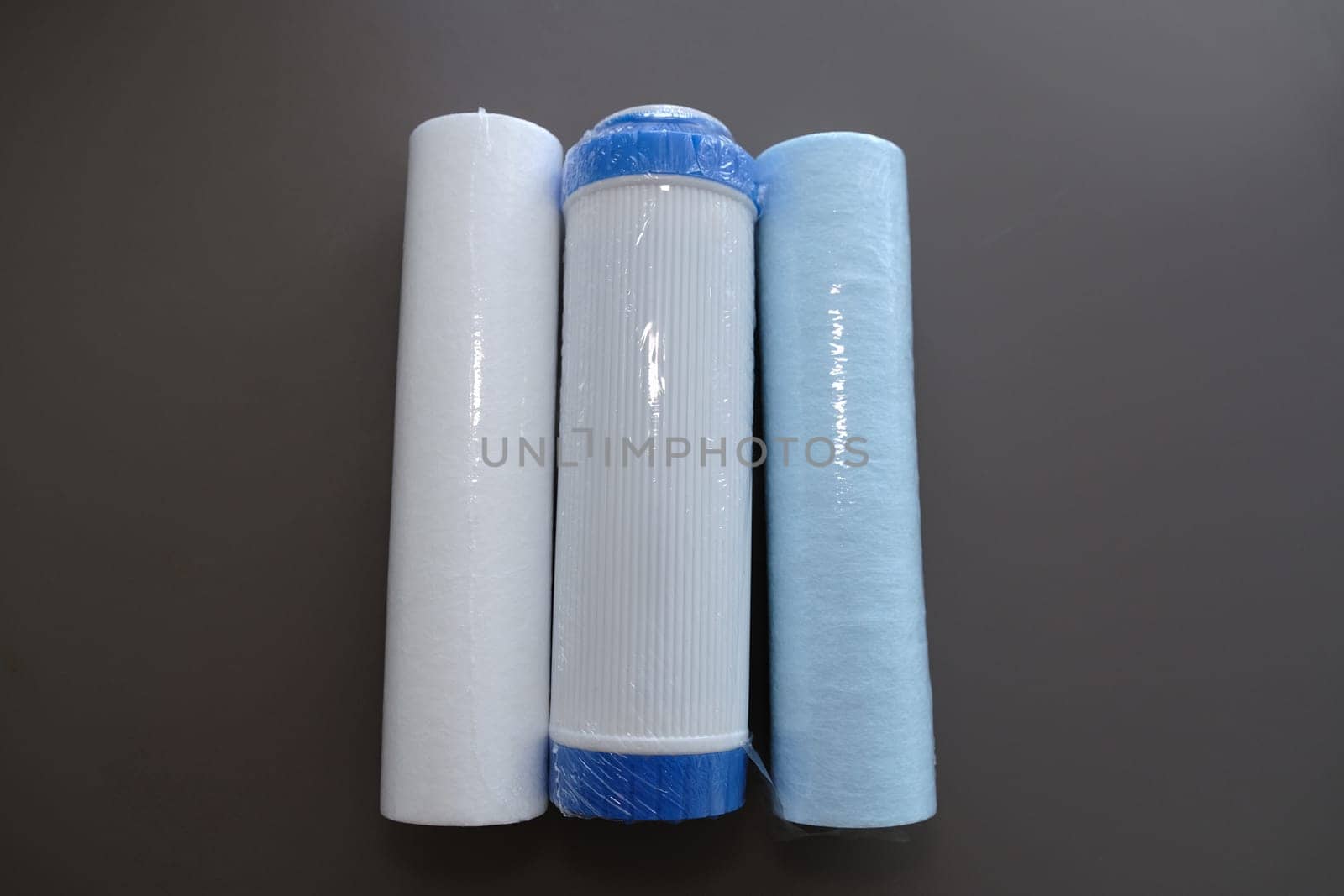 cartridges for water filter isolated on grey.