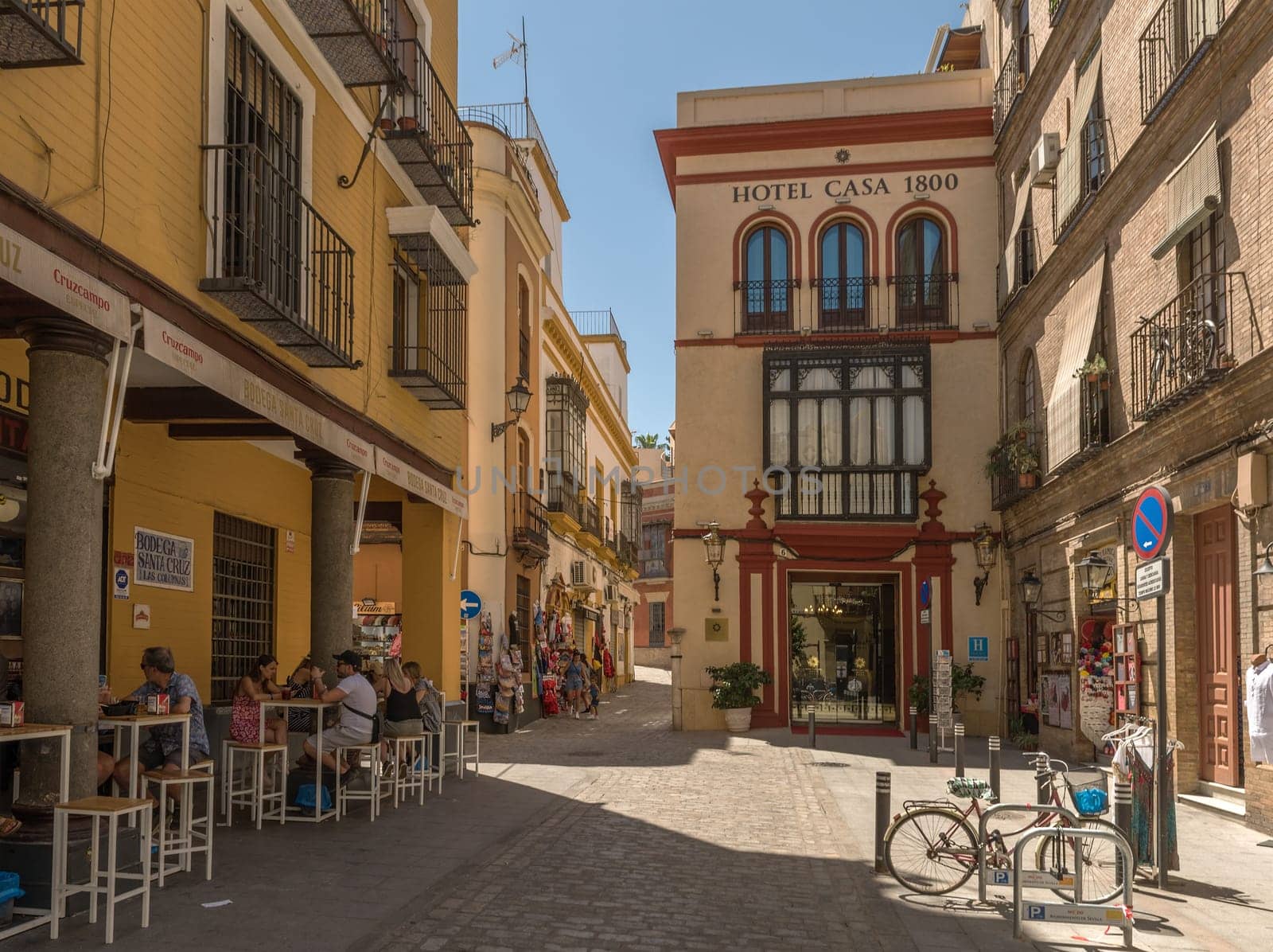 small narrow street in the historic old town of Seville, Spain