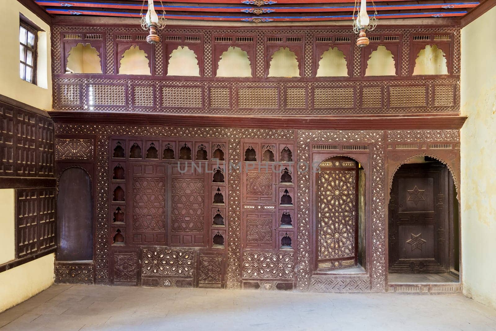 Oriental wooden engraved arabesque decorations with balcony installed inside empty spacious room
