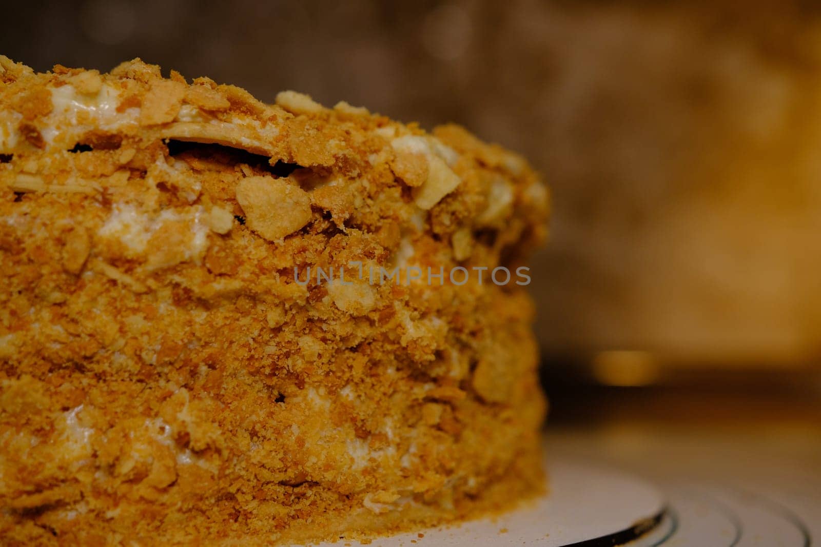 Board with delicious Napoleon cake, close up with selective blur.