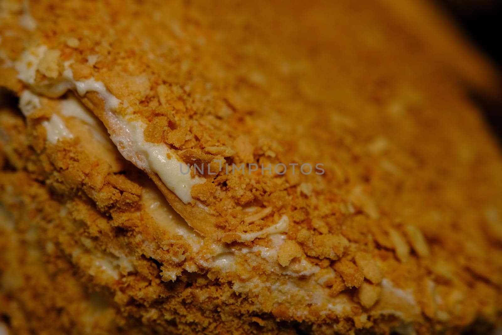 Board with delicious Napoleon cake, close up with selective blur.