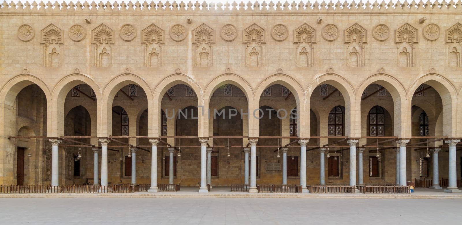 Arched corridor surrounding the courtyard of public ancient mosque of Sultan Al Moaayad, Old Cairo, Egypt