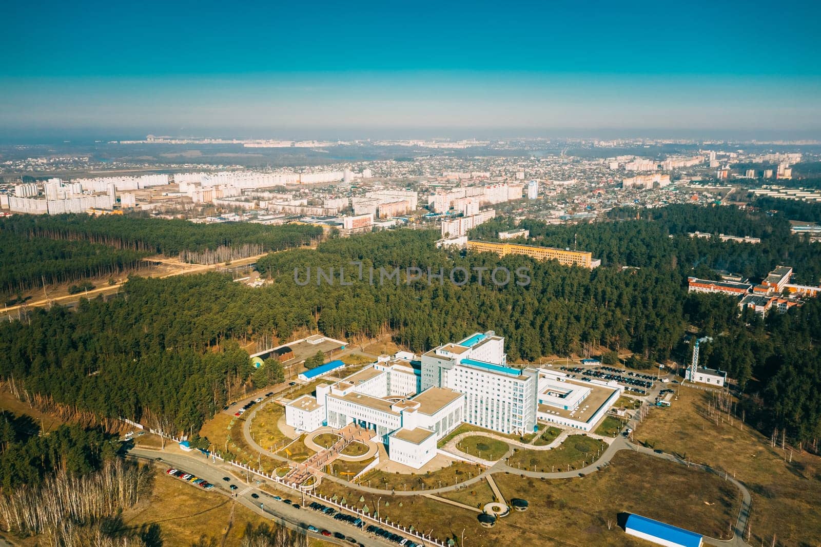 Aerial View OF Building Of Scientific Center For Radiation Medicine And Human Ecology In Spring Sunny Day. Top View. Drone View. Bird's Eye View