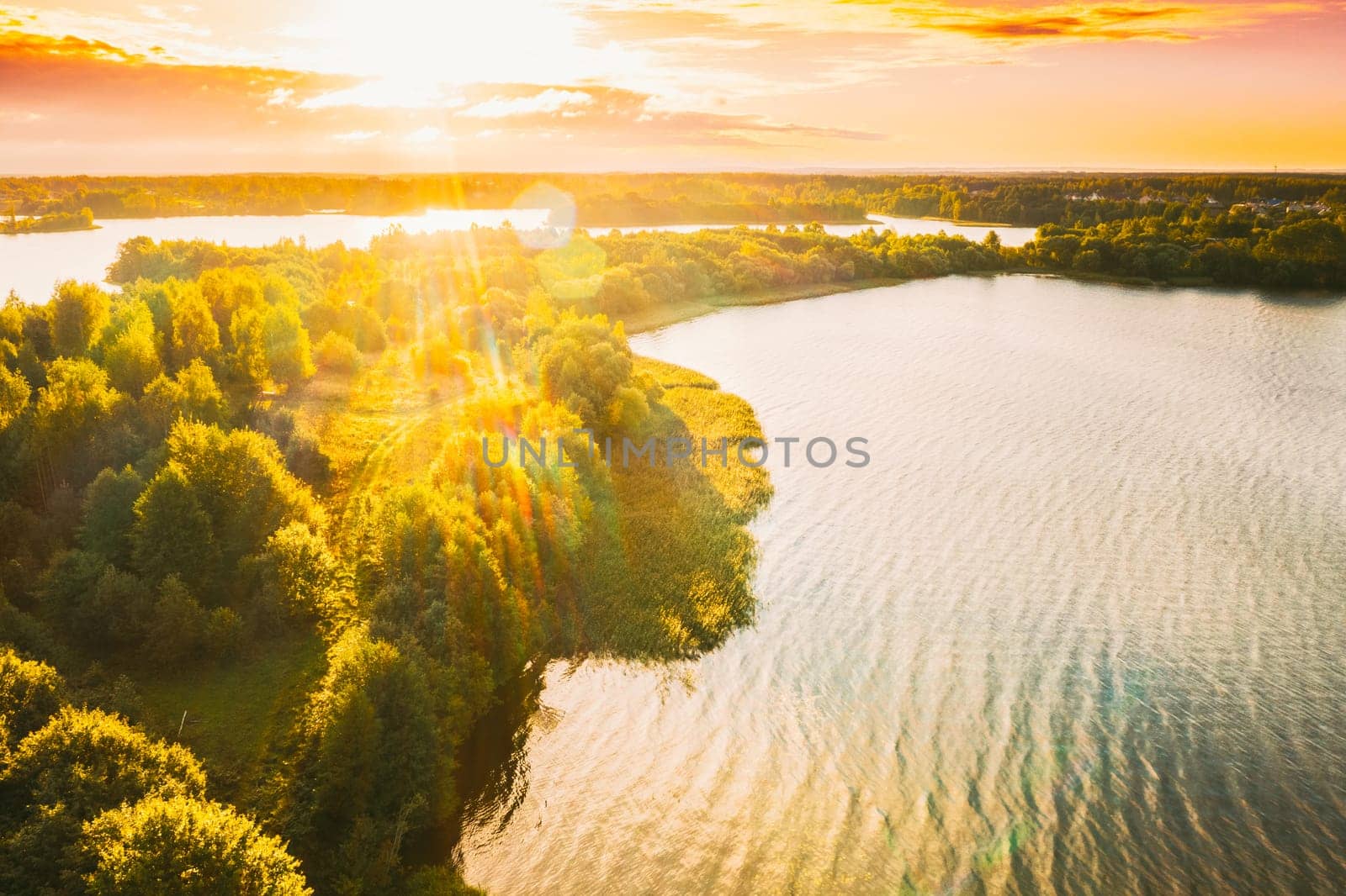 Belarus. Elevated View Of Green Forest Growth On River Coast Landscape In Sunny Summer Morning