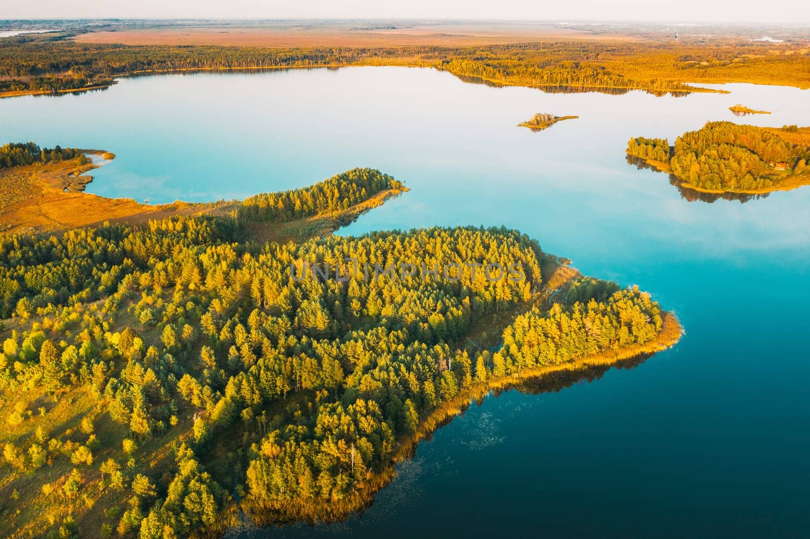 Braslaw District, Vitebsk Voblast, Belarus. Aerial View Of Ikazn Lake, Green Forest Landscape. Top View Of Beautiful European Nature From High Attitude. Bird's Eye View. Famous Lakes.