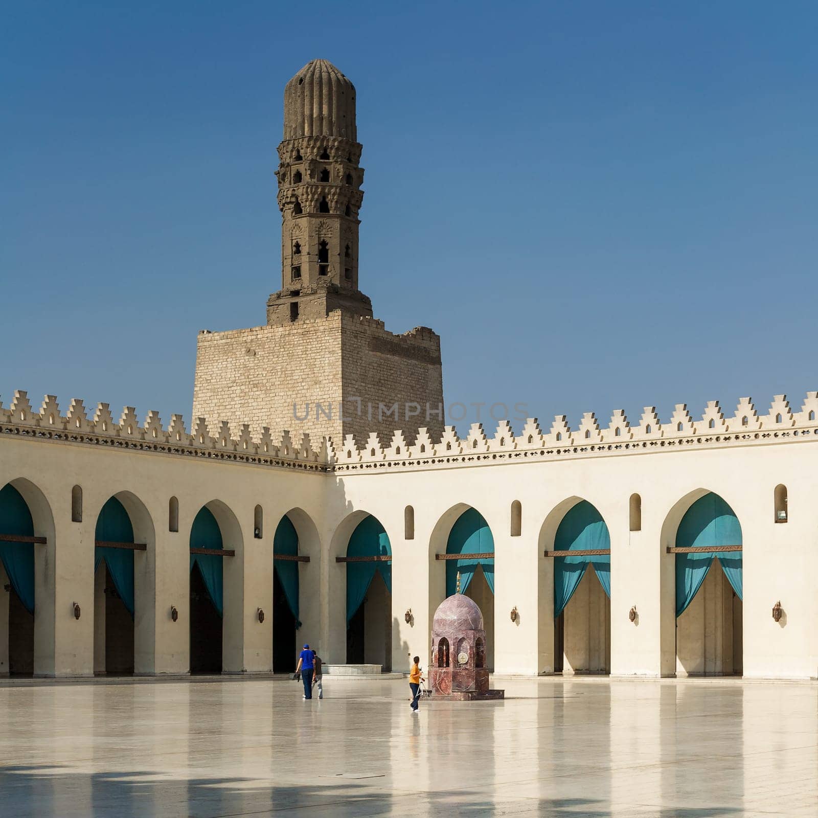 Cairo, Egypt- September 28 2012: Minaret of public historic Al Hakim Mosque known as The Enlightened Mosque, located in Moez Street, south of the old door of old Cairo gate named Bab Al-Futuh