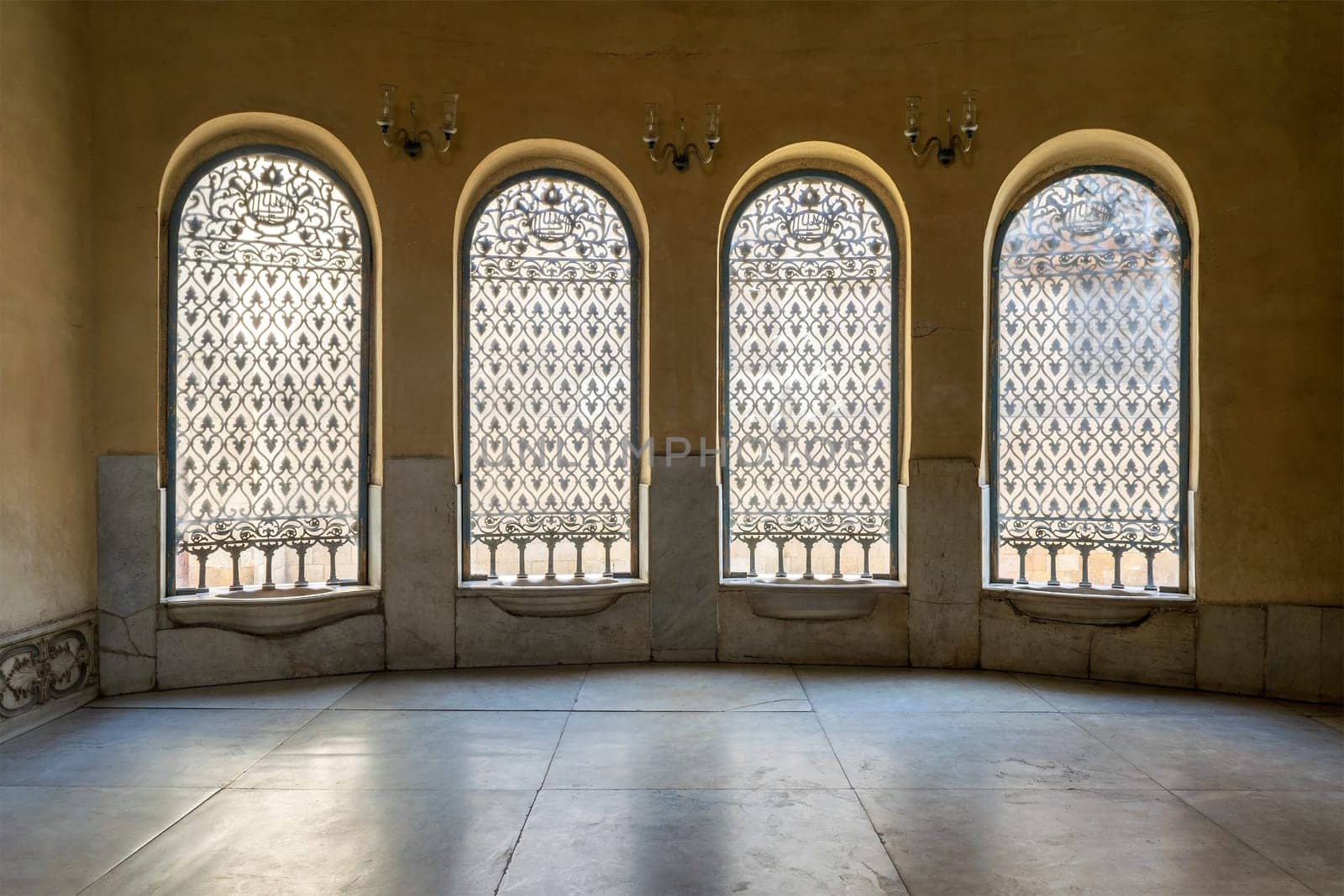 Old abandoned Ottoman era historic Soliman Agha El Silahdar Sabil public building with four windows covered by decorated iron grid, Moez Street, Cairo, Egypt