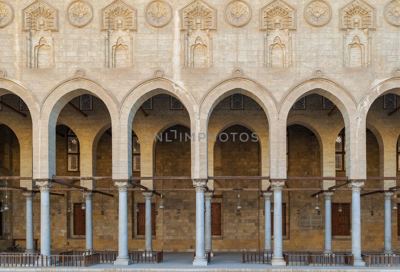 Arched corridor surrounding the courtyard of public ancient mosque of Sultan Al Moaayad, Old Cairo, Egypt