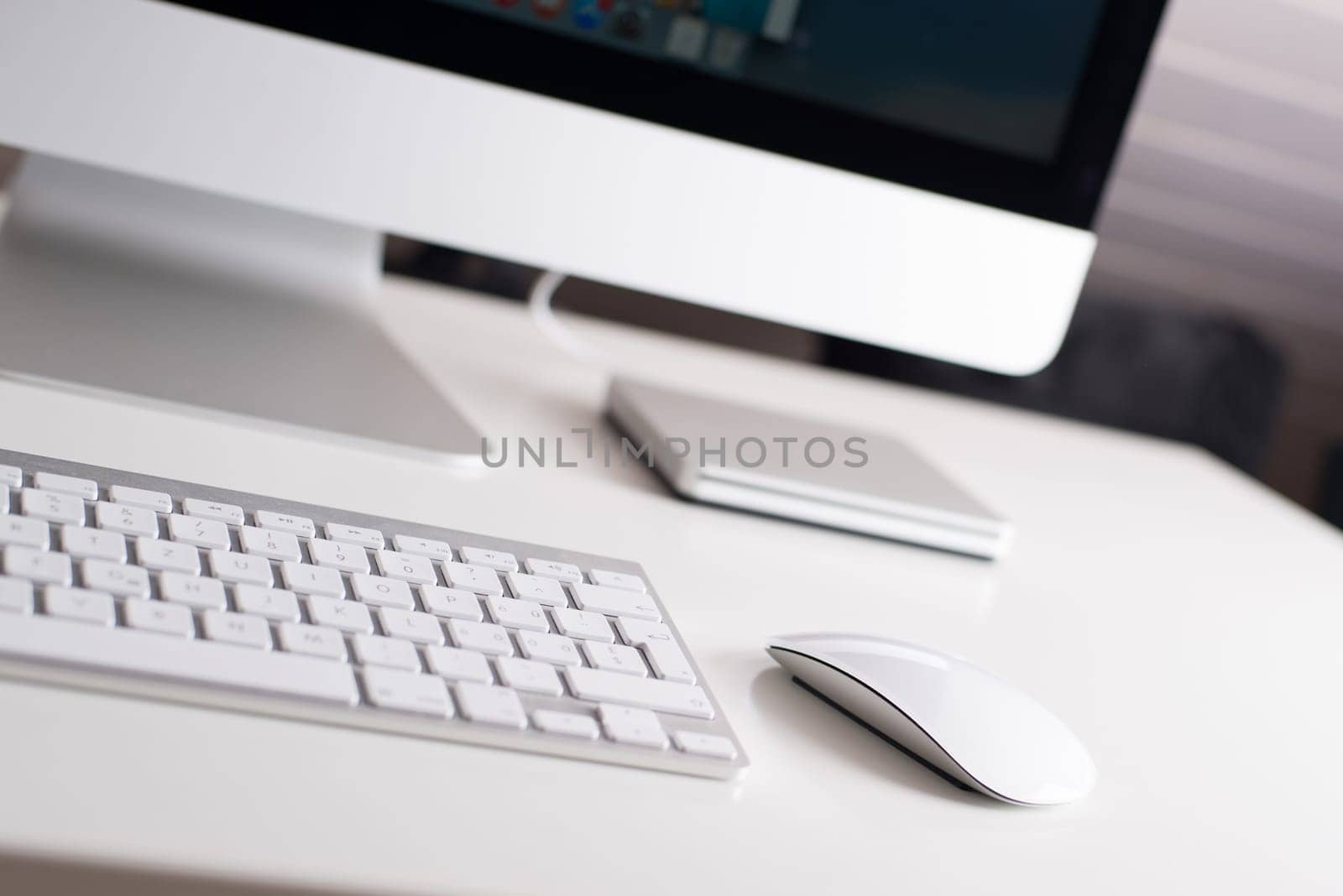 Desktop monitor with a wireless keyboard, mouse and dvd drive