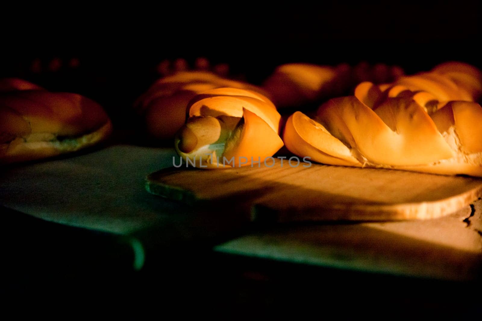 Oven inside plenty of bread. Manufacturing process of spanish bread