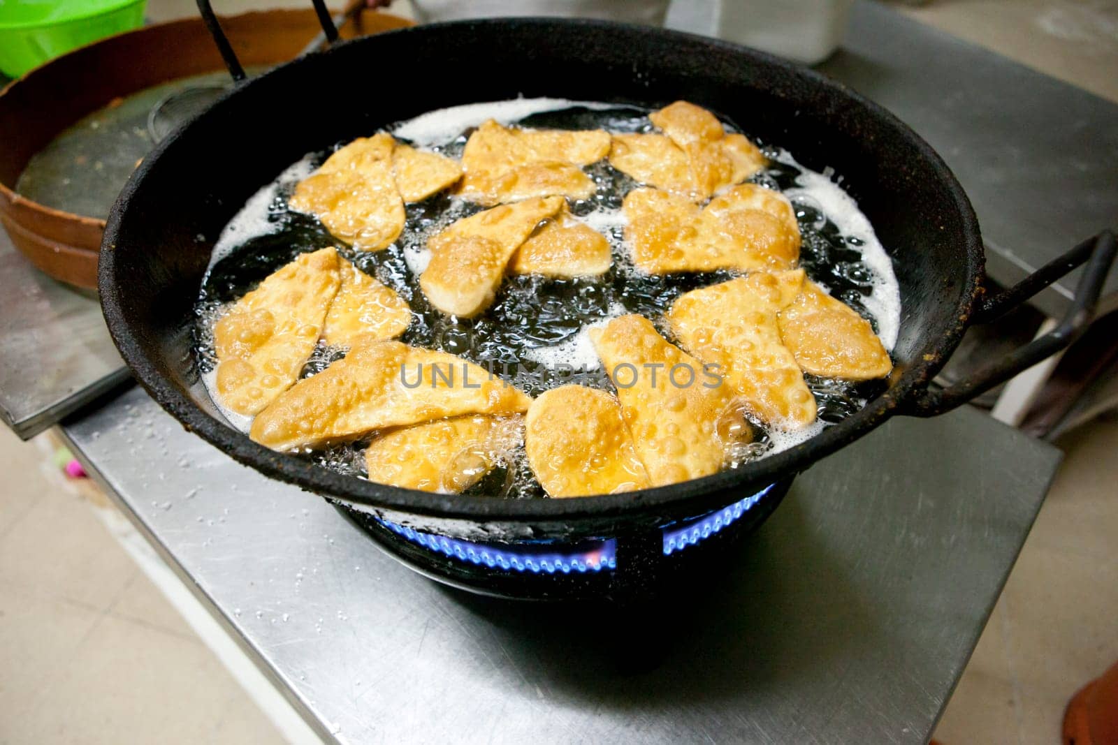 Elaboration process of traditional coated fritter of Extremadura, Spain, called escaldones