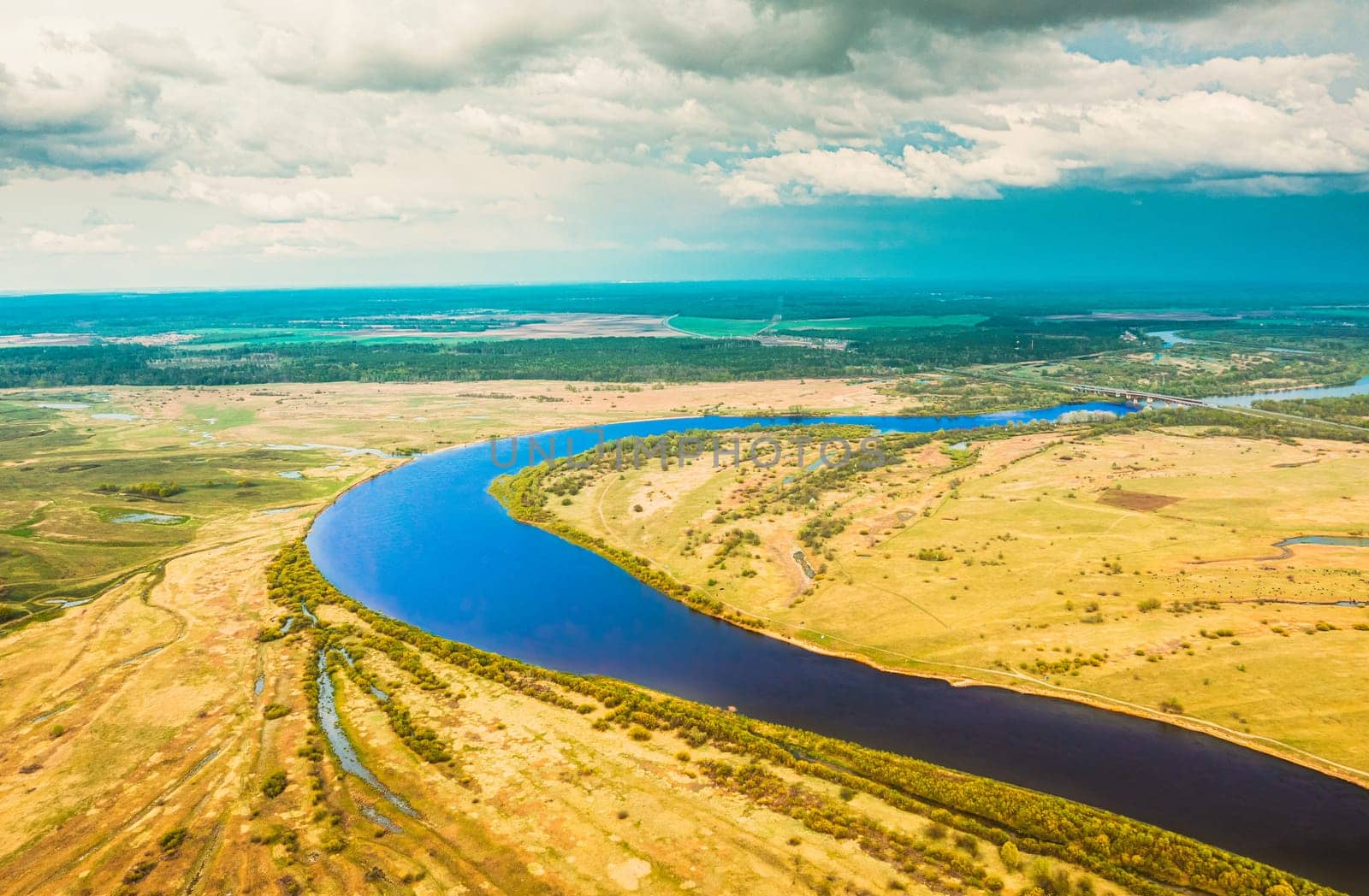 Rechytsa, Gomel Region, Belarus. Aerial View Of Dnieper River. Sky Above Green Meadow And River Landscape. Top View Of European Nature From High Attitude In Summer. Bird's Eye View.