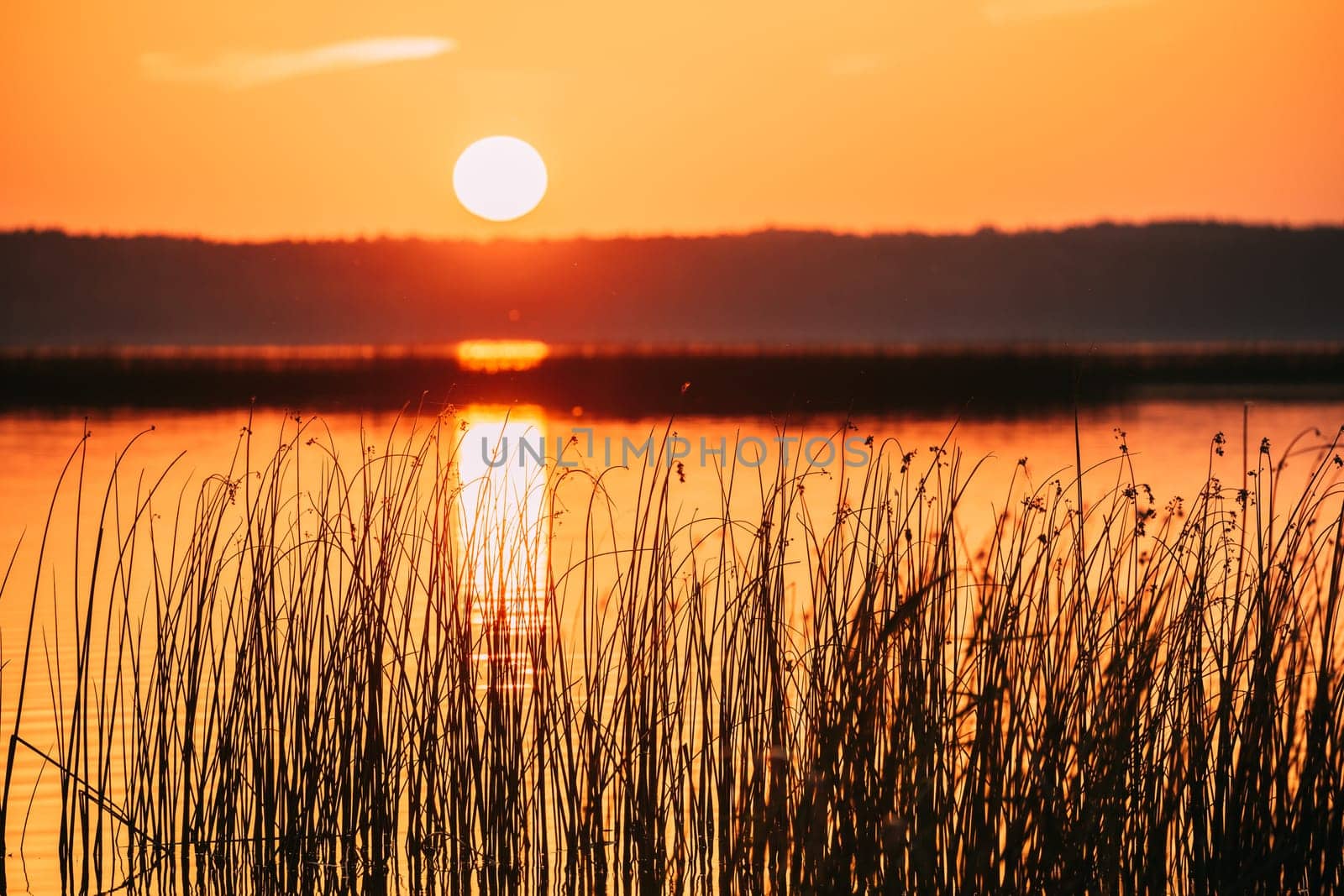 Sundown Above Lake River Horizon At Sunset. Natural Sky In Warm Colors Water. Sun Waters.
