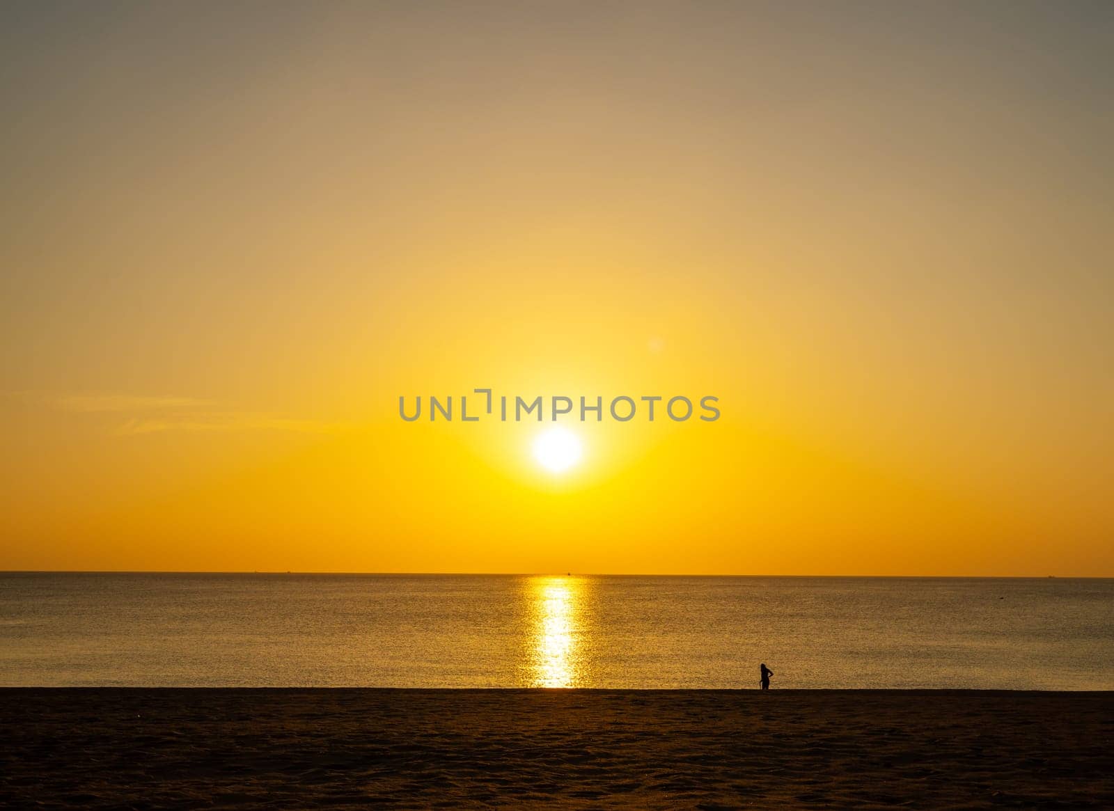 Beach sand sunset or sunrise with colorful of cloud sky and sunlight in twilight