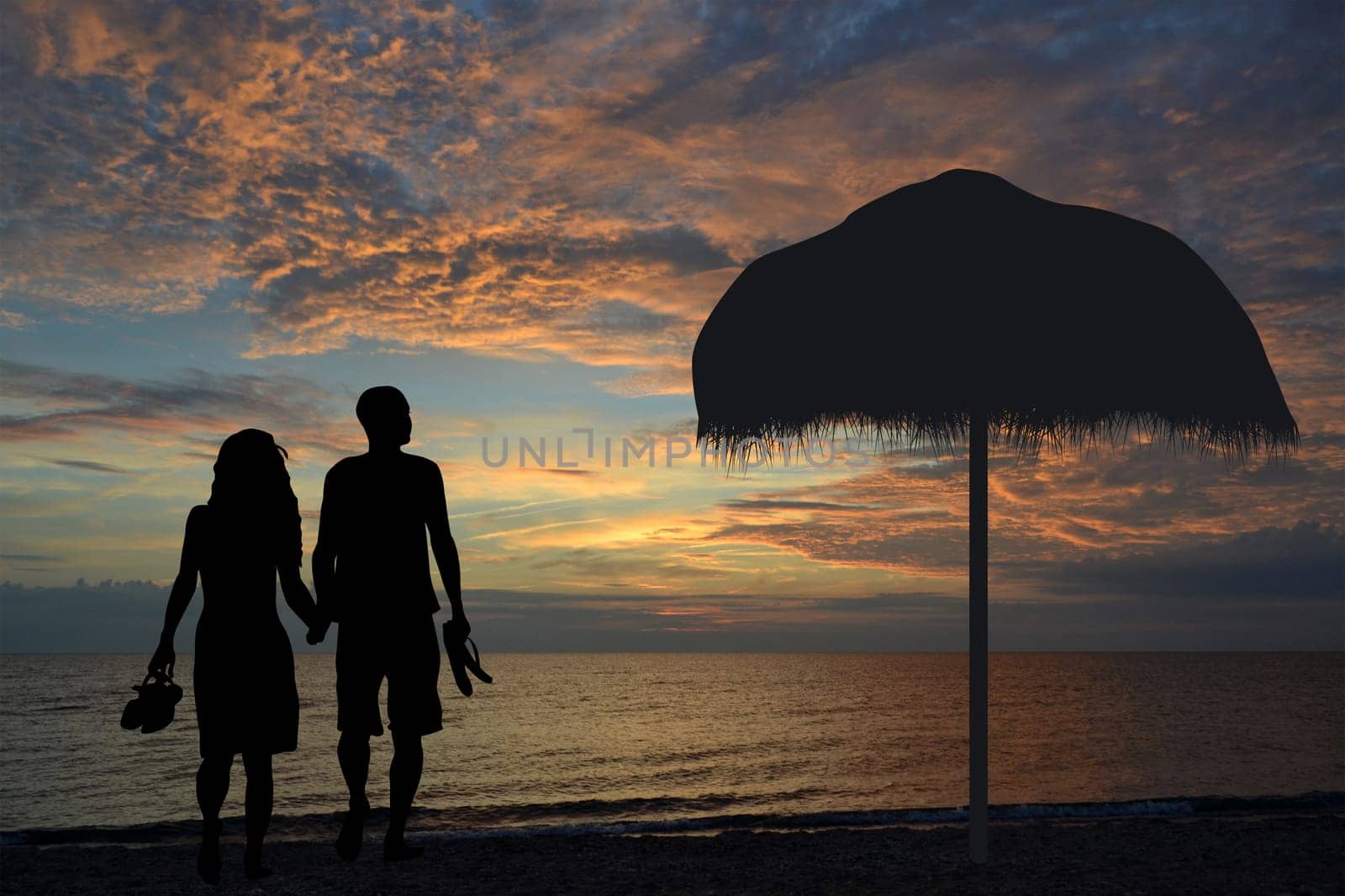 Romantic couple  walking on the beach holding hands together in the  sunset with slippers in hand