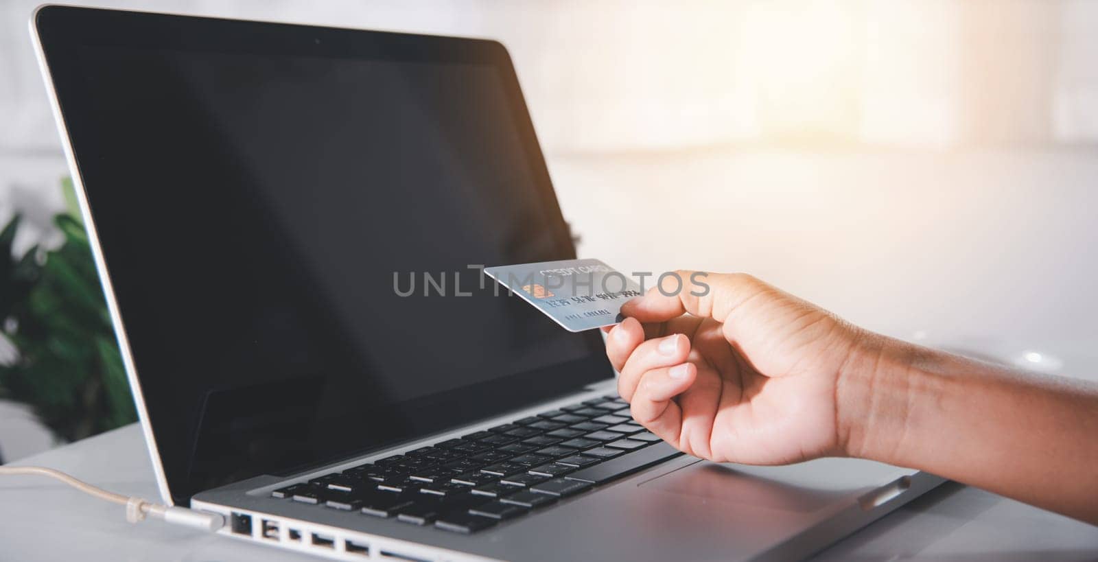 Female register via credit cards on computer make electronic payment security online, Woman hands holding credit card and using laptop with product purchase at home, Internet online shopping concept