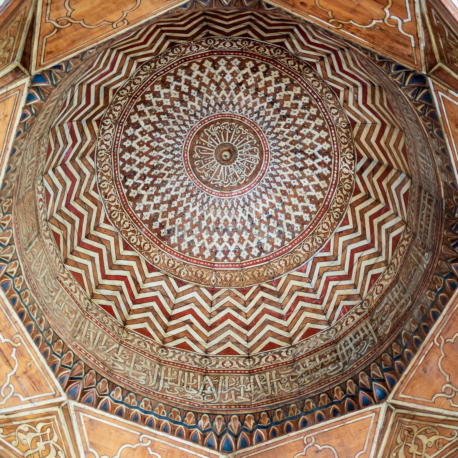 Dome decorated with calligraphy and colorful floral and geometric patterns at Mamluk era public historic Al-Sultan Al-Zahir Barquq Mosque, Moez Street, Old Cairo, Egypt
