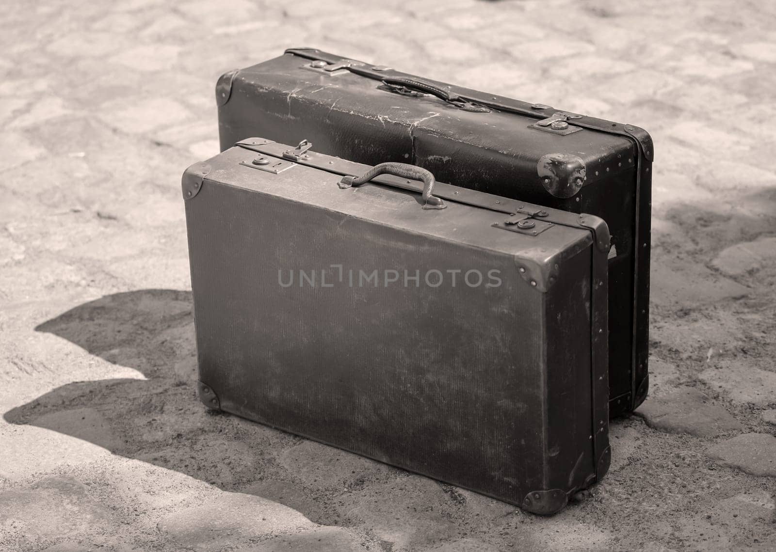 A close-up, detail shot of an old leather suitcase.