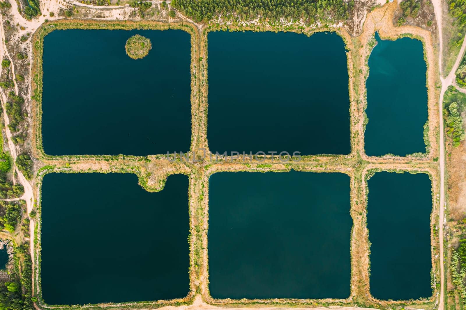 Aerial View Retention Basins, Wet Pond, Wet Detention Basin Or Stormwater Management Pond, Is An Artificial Pond With Vegetation Around The Perimeter, And Includes A Permanent Pool Of Water In Its Design.