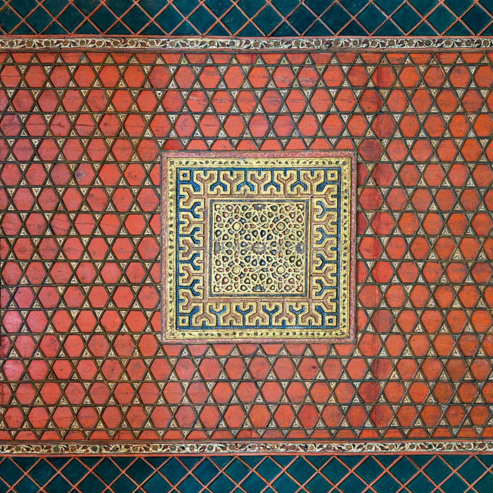 Part of wooden ceiling decorated with floral patterns painted in red and blue at Mamluk era Prince Taz Palace situated on the intersection of Saliba Street and Suyufiyya Street, Medieval Cairo, Egypt