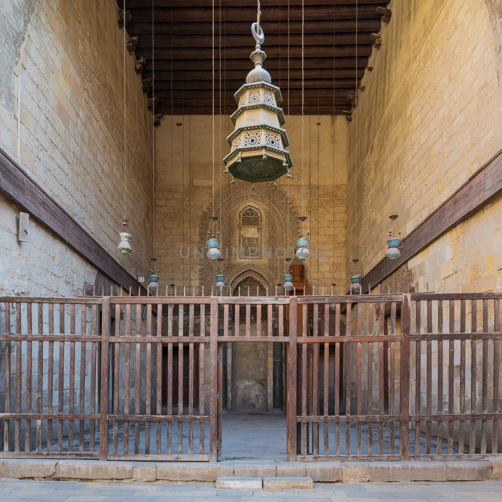 Main courtyard of public historic mosque of Sultan Al Nassir Qalawun with huge arch, Cairo, Egypt