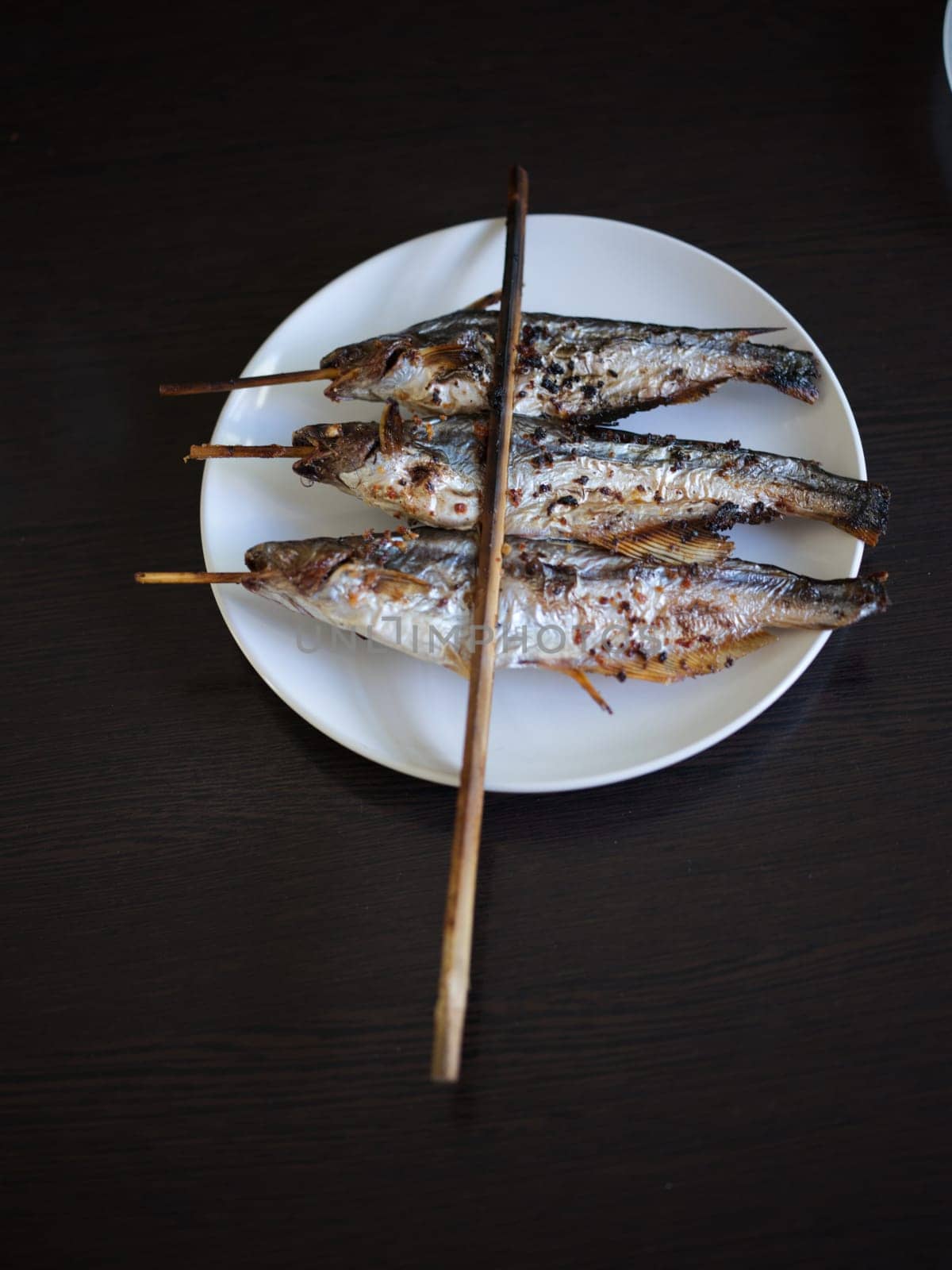 Grilled Fish skewers in Mekong River . THAIFOOD