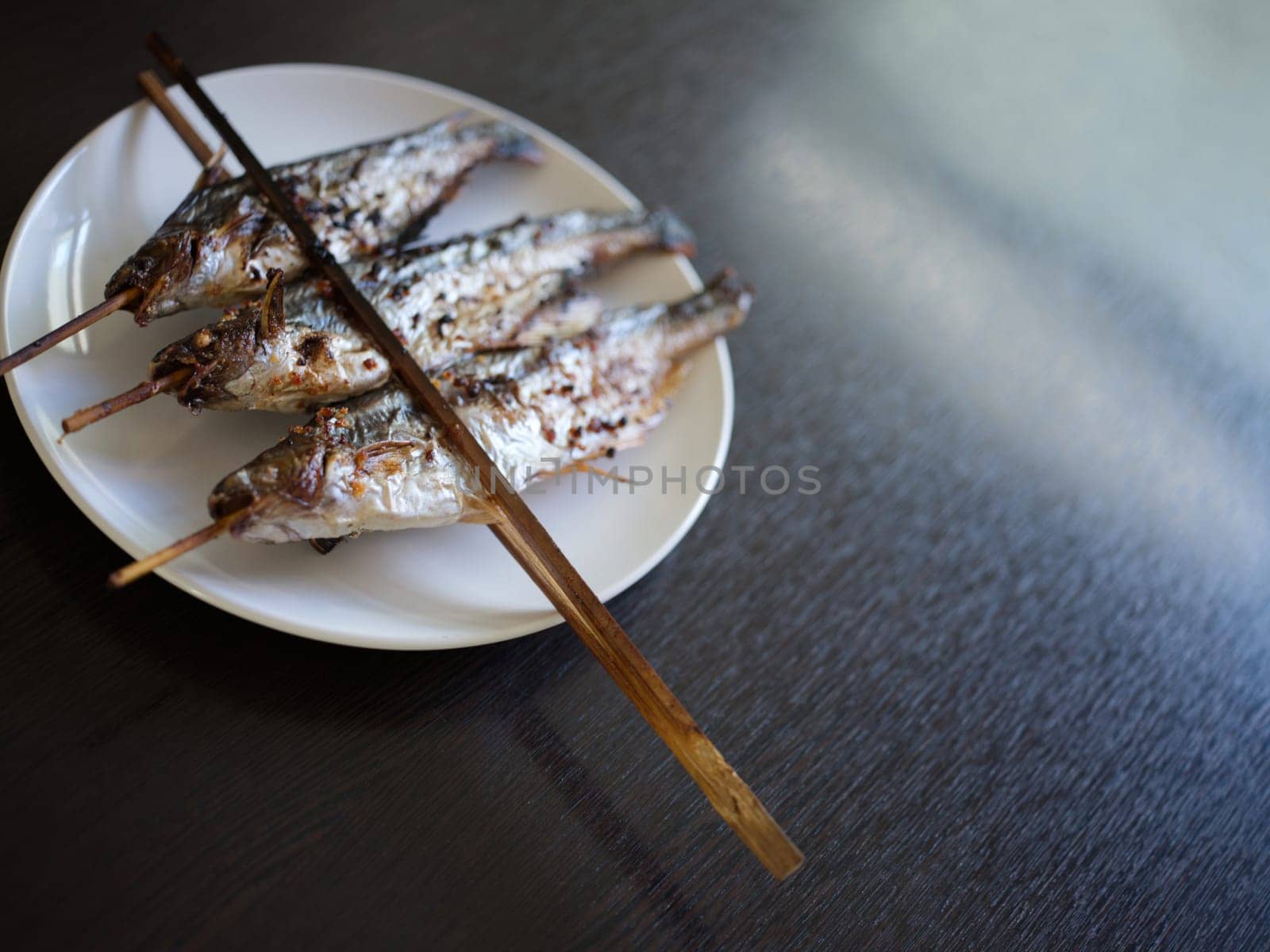 Grilled Fish skewers in Mekong River . THAIFOOD