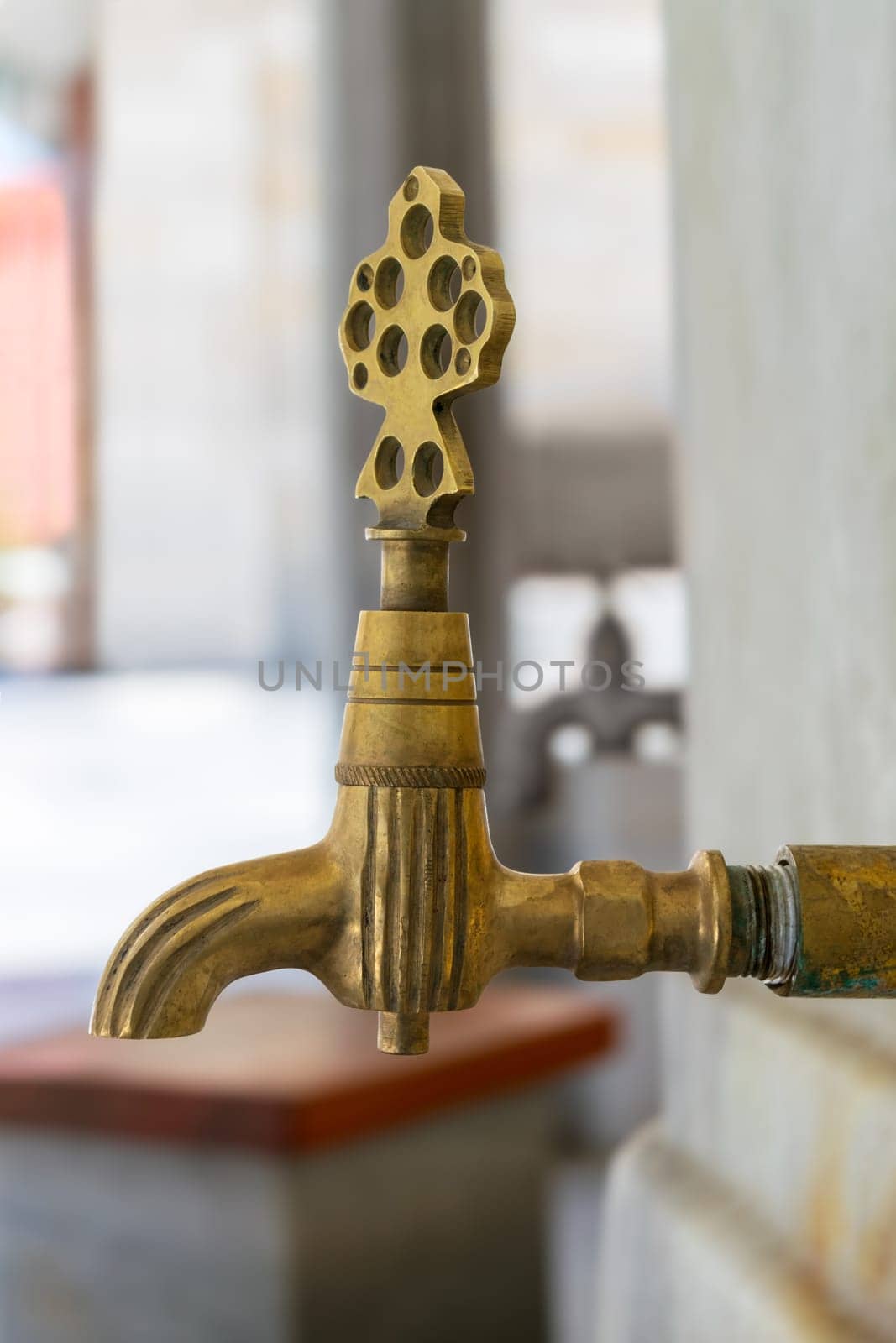 Turkish Ottoman style antique ablution tap at the ablution fountain outside of Fatih Mosque, Istanbul, Turkey, includes clipping path