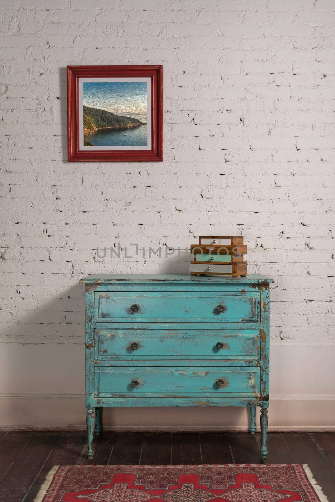 White brick wall with shabby chic vintage turquoise cabinet and hanged painting in living room, with clipping path for the painting