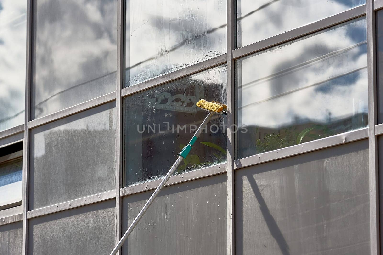 window washing, washing a street shop window. High quality photo