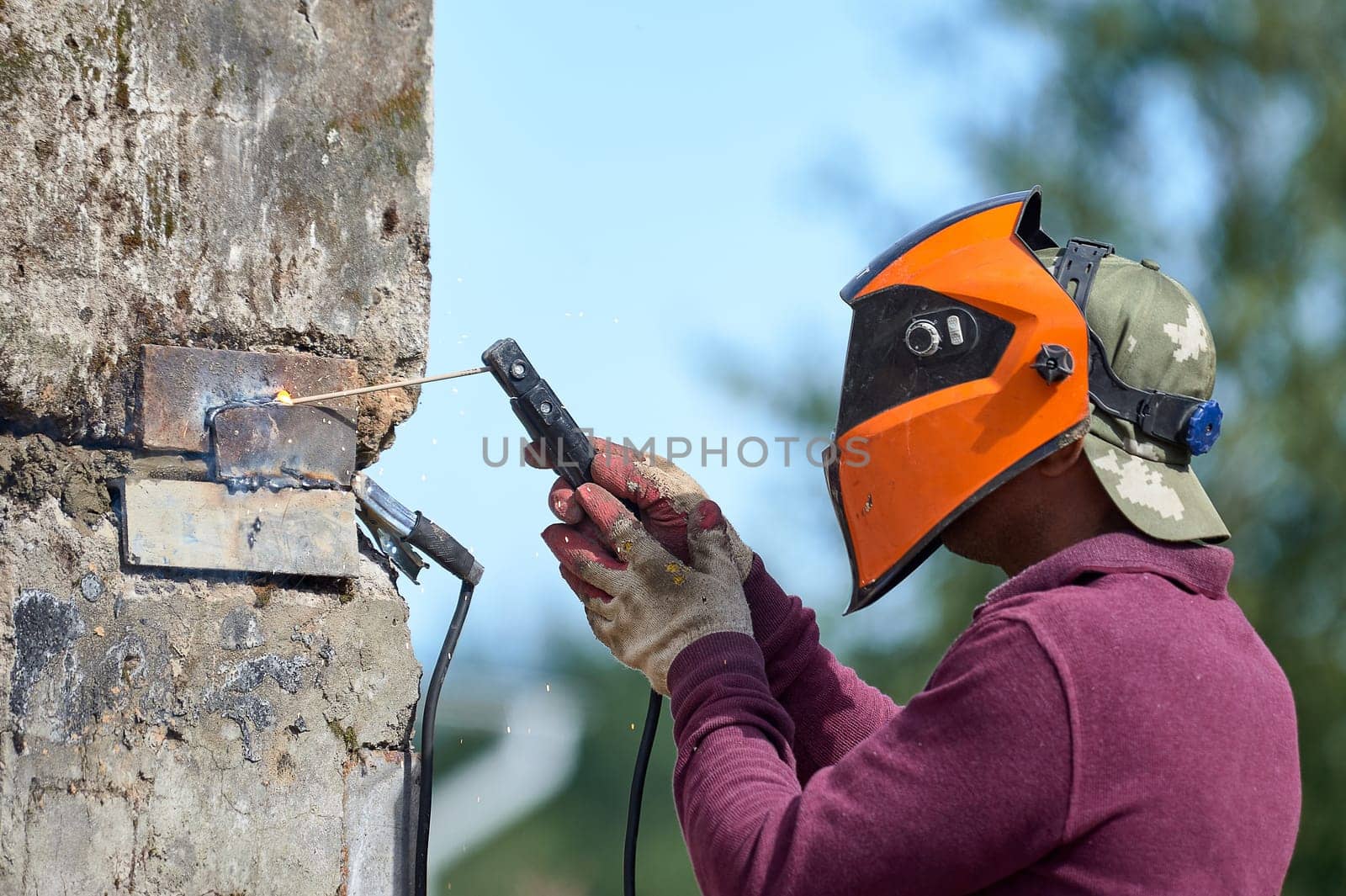 The welder welds reinforced concrete products together. High quality photo
