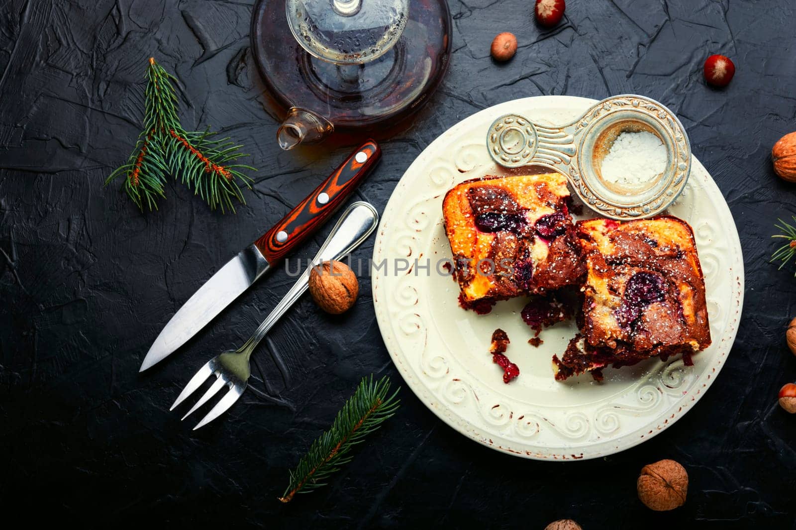 Piece of pie with chocolate, cherries and nuts. Sweet marble cake.