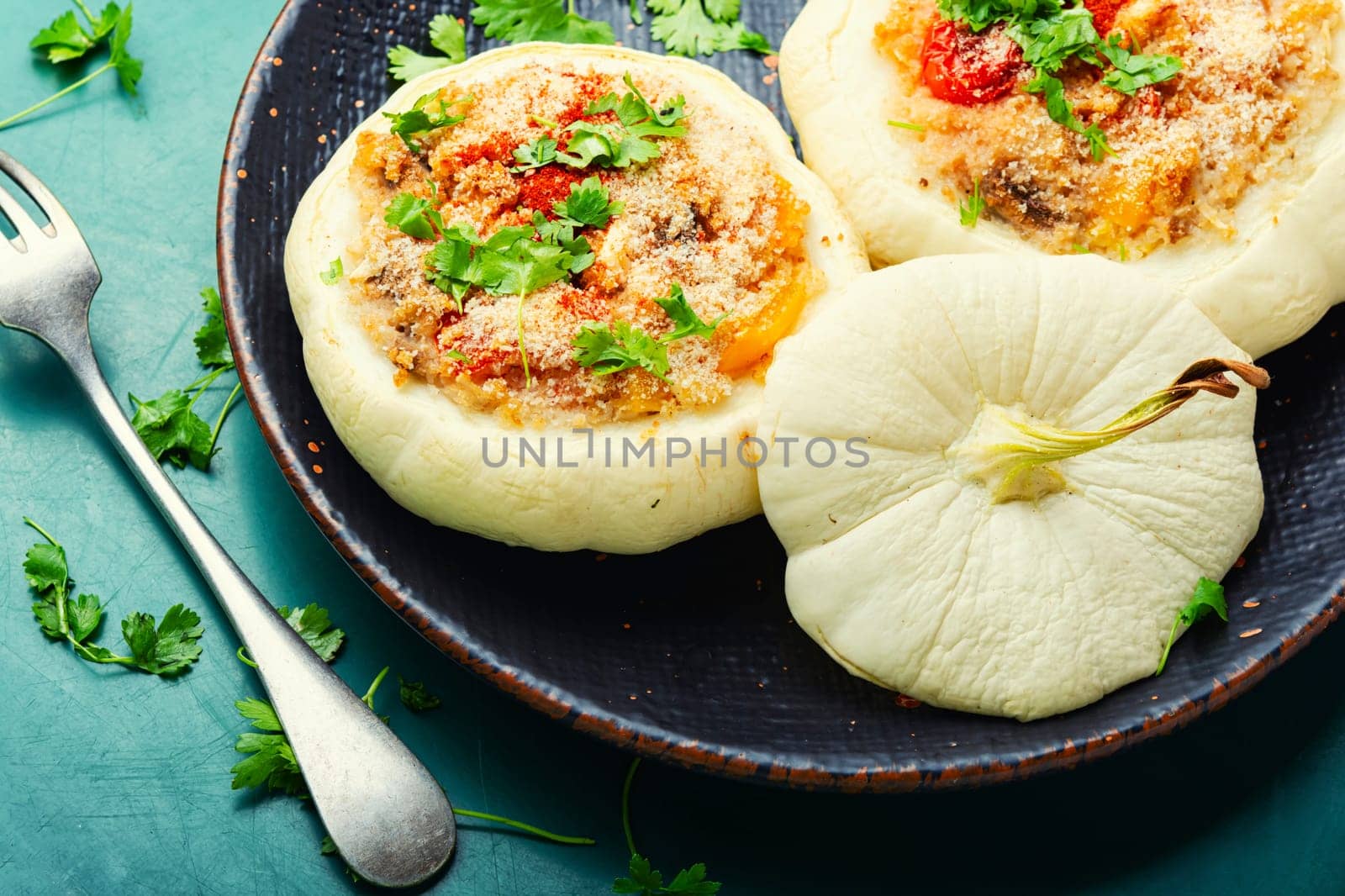 Baked zucchini stuffed with quinoa and vegetables. Vegetarian food