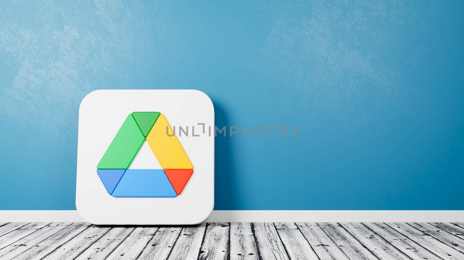Google Drive App Logo 3D Symbol Shape on Wooden Floor Against Blue Wall with Copy Space 3D Render Illustration