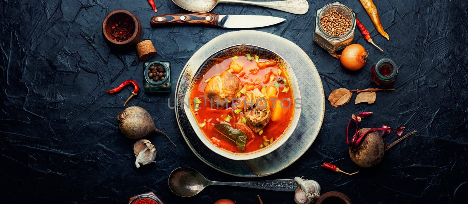 Borscht - hot soup with beets and meat. Red borscht, traditional dish of russian cuisine
