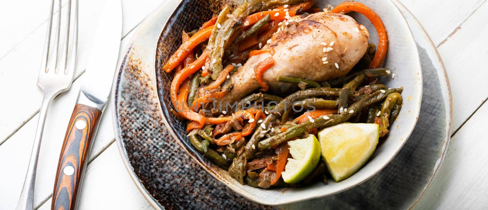 Roasted chicken with vegetable garnish and spices. Braised spicy chicken legs.