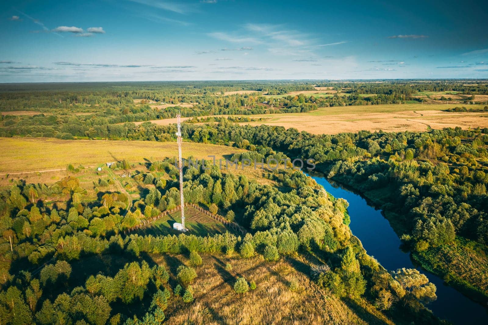 Telecommunications Cell Phone Tower With Antenna In Countryside. Belarus. Aerial View.