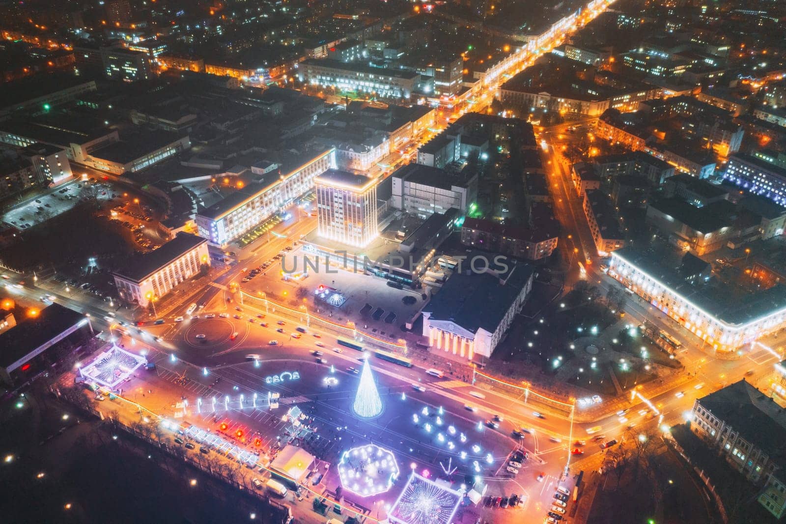 Gomel, Belarus. Main Christmas Tree And Festive Illumination On Lenin Square In Homel. New Year In Belarus. Aerial Night View.