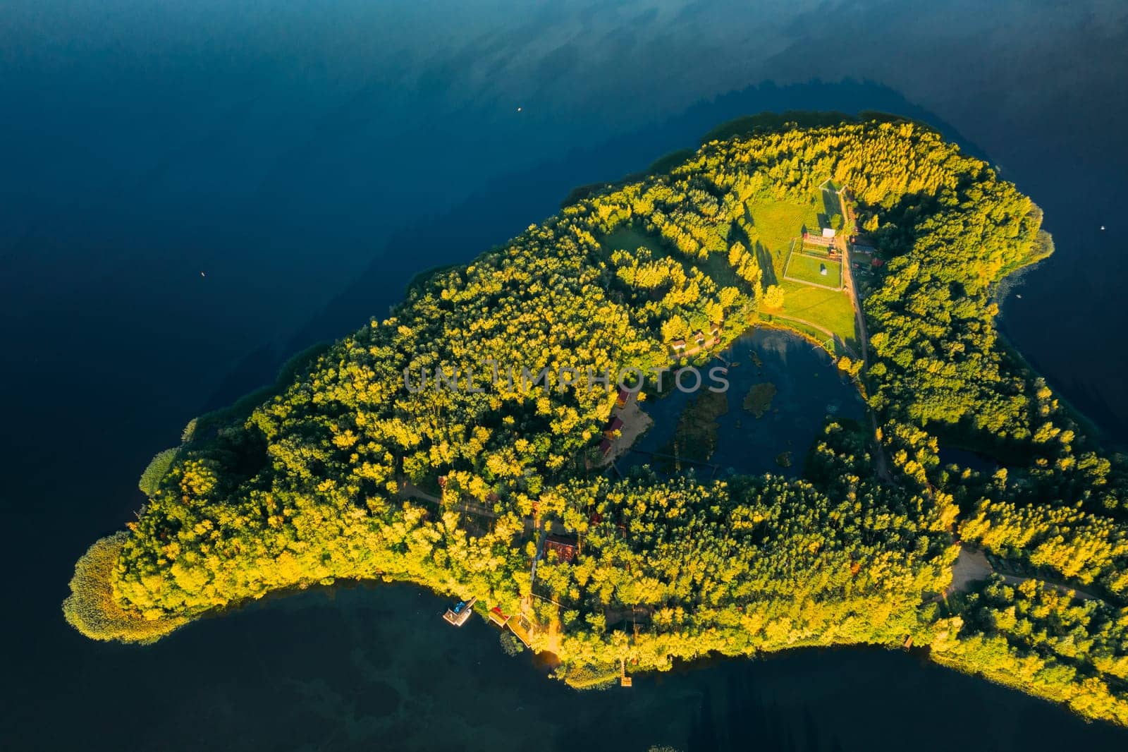 Novoe Lyadno, Beloozerny District, Vitebsk Region, Belarus. Aerial View Of Tourist Complex Pension Lode In Summer Sunny Day. Resort On Island Belarus In Pension Lode. Top View Of European Nature From High Attitude In Summer. Bird's Eye View Of Lepel Lake. Flat View.