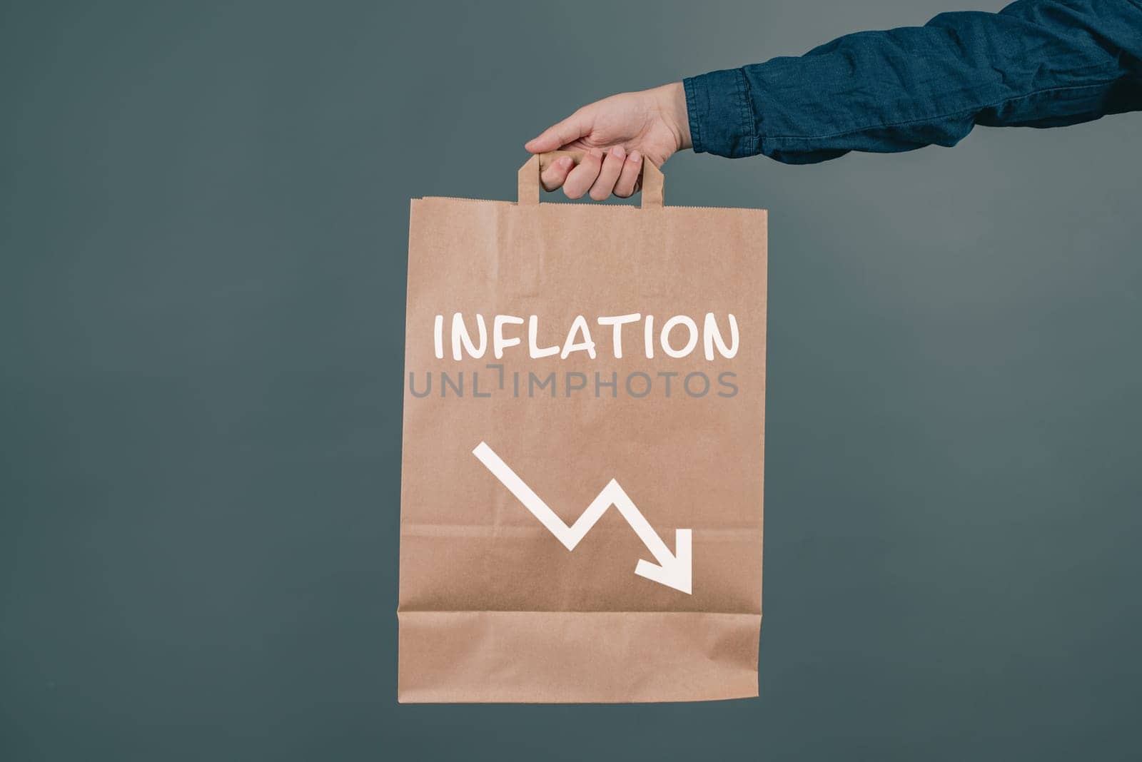 Inflation and financial crash, man holding empty shopping bag, economic development and increasing prices for food and energy
