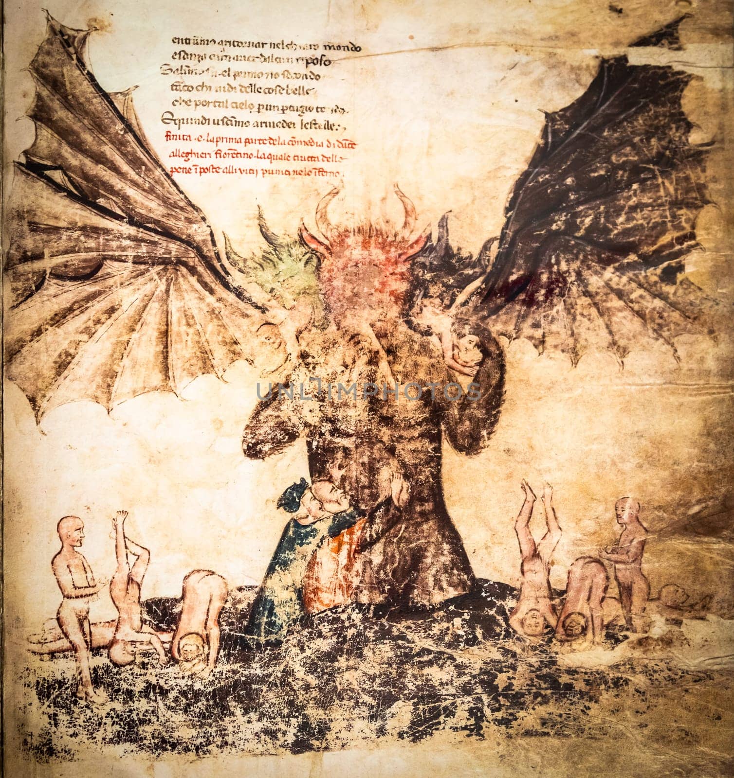 FLORENCE, ITALY - circa July 2021. Antique manuscript sheet from a gothic book with satanic hell illustration, 16th Century copy.