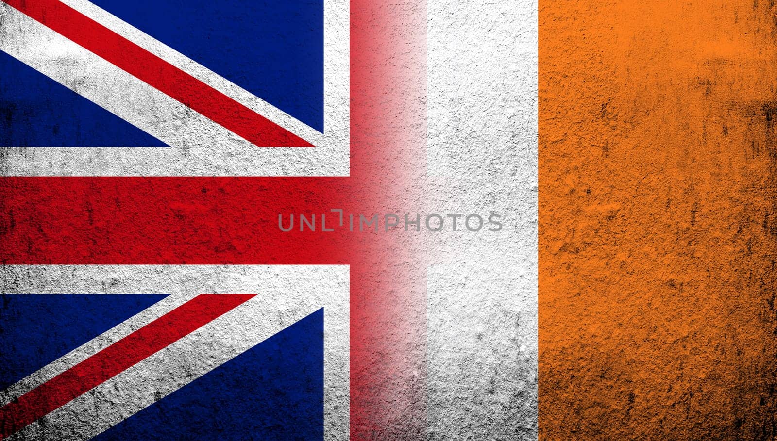 National flag of United Kingdom (Great Britain) Union Jack with The Republic of Ireland National flag. Grunge background