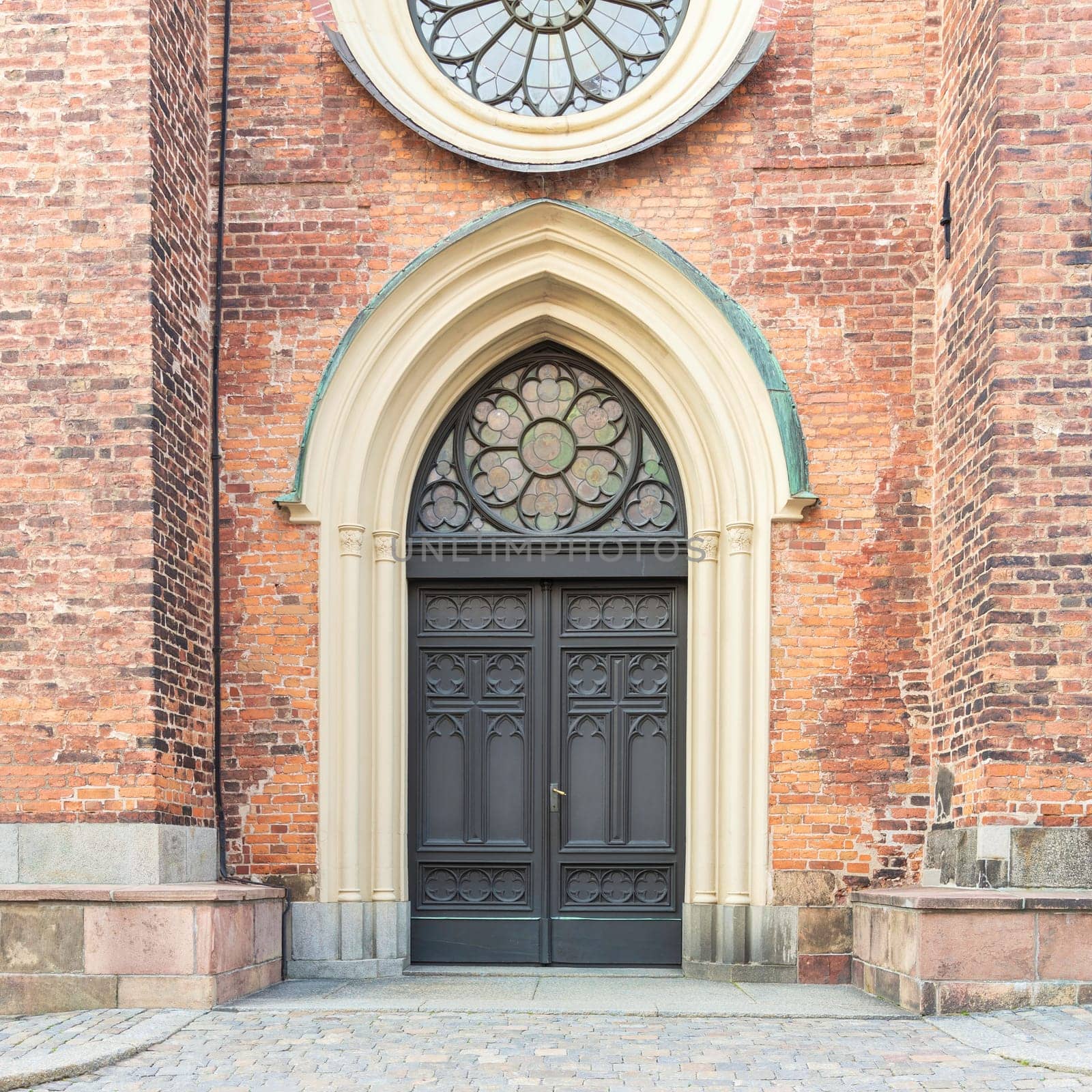Entrance of Riddarholmen Church, located in the island of Riddarholmshamnen, old city, Gamla stan. before sunset in a summer day, Stockholm, Sweden
