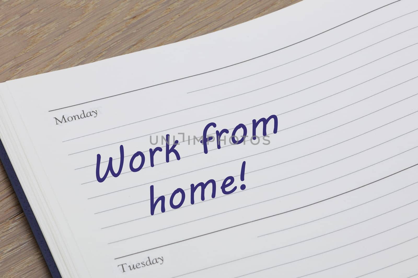 A Work from home diary reminder appointment open on desk