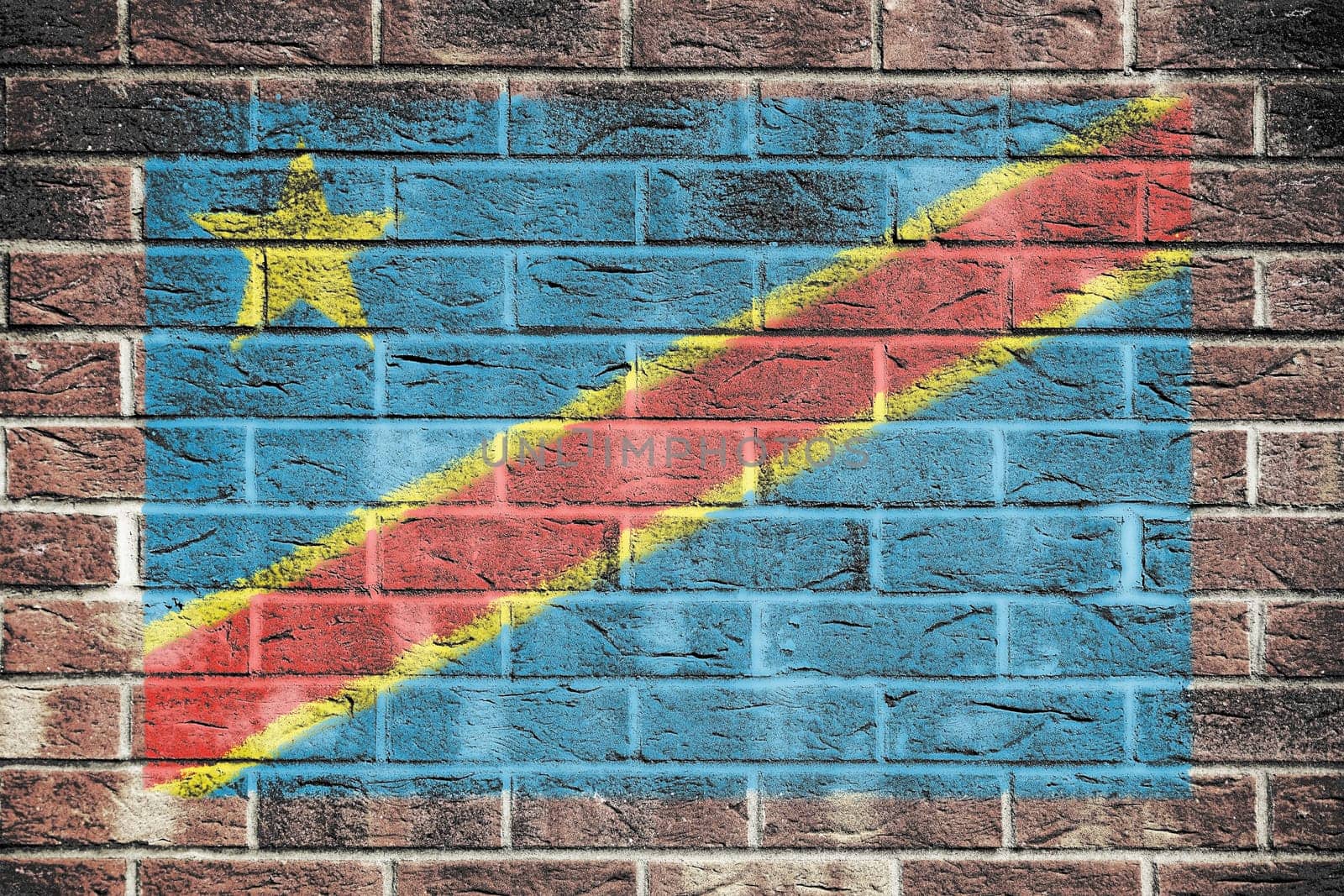 A Democratic Republic of Congo flag on a brick wall background